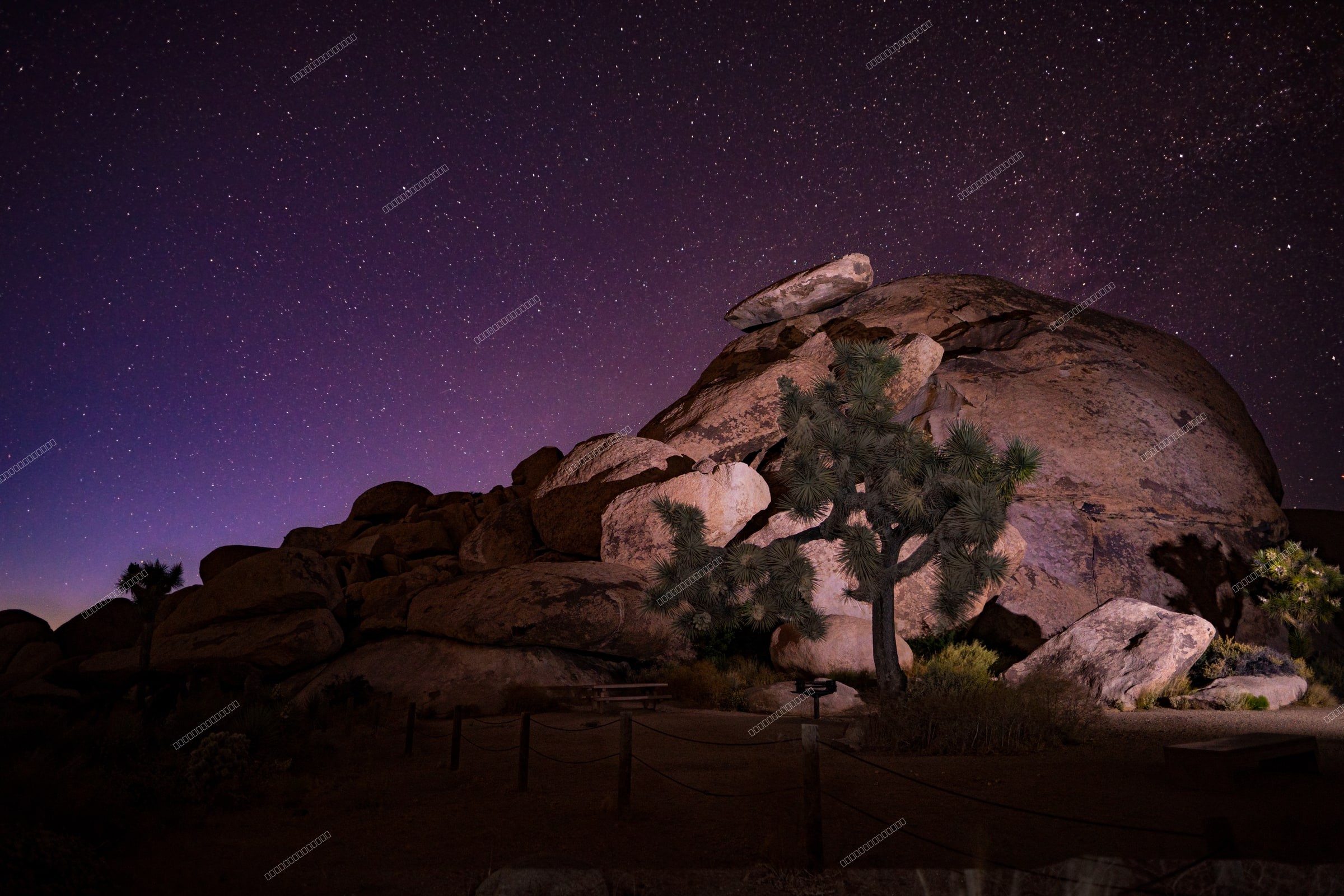 Backlit Sentinel'Cap Rock Under the Stars